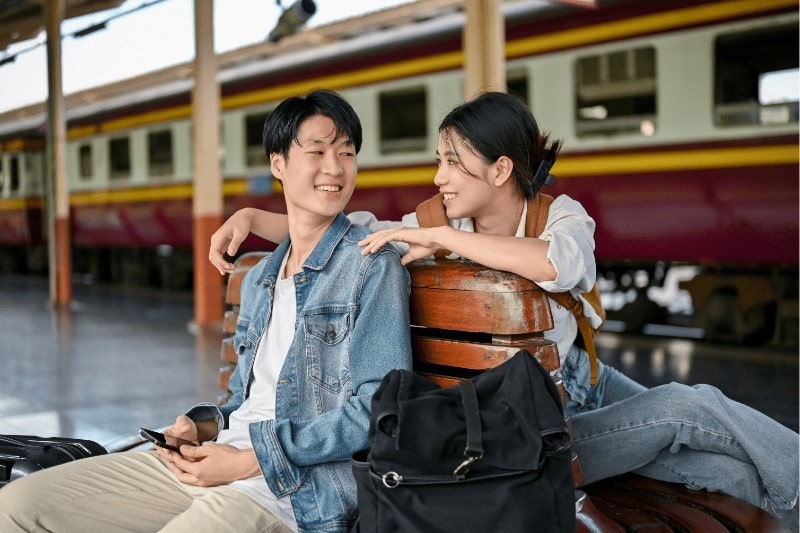 Young asian couple on a trip, enjoying peace of mind knowing they have secured their travel protection through Choice Protect360’s annual travel coverage.