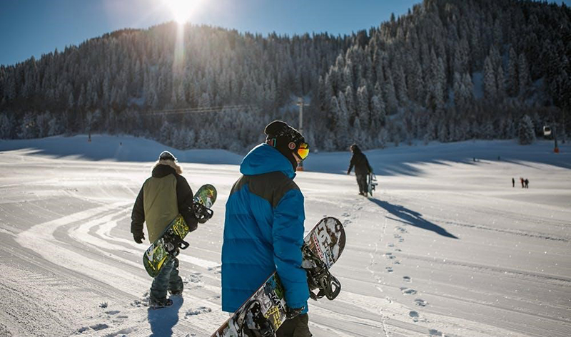 people getting ready to go snowboarding